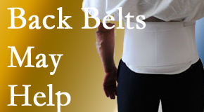 Oxford back pain sufferers wearing back support belts are supported and reminded to move carefully while healing.