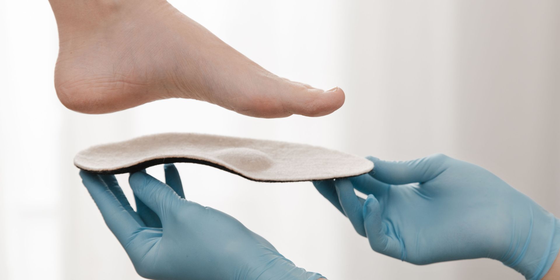 examining feet for orthotics